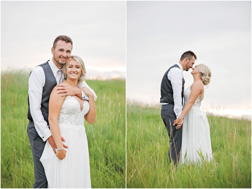 Bride and groom standing in a field during a summer wedding