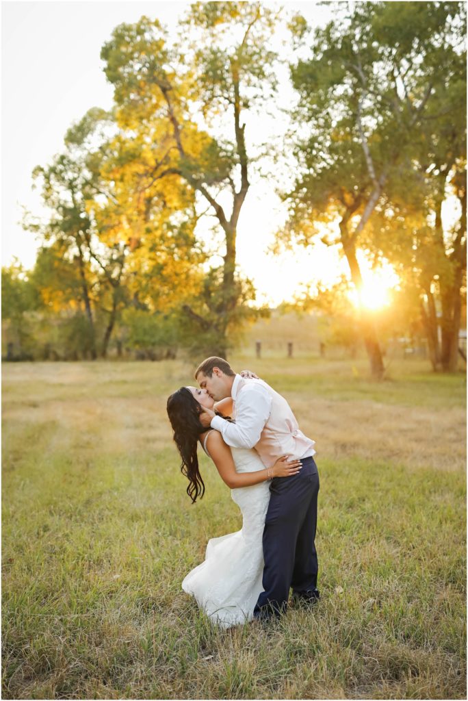 Romantic Swift River Wedding Bride and Groom Sunset Dipping Kissing