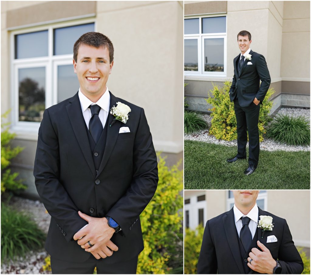 Groom in black and white suit at wedding