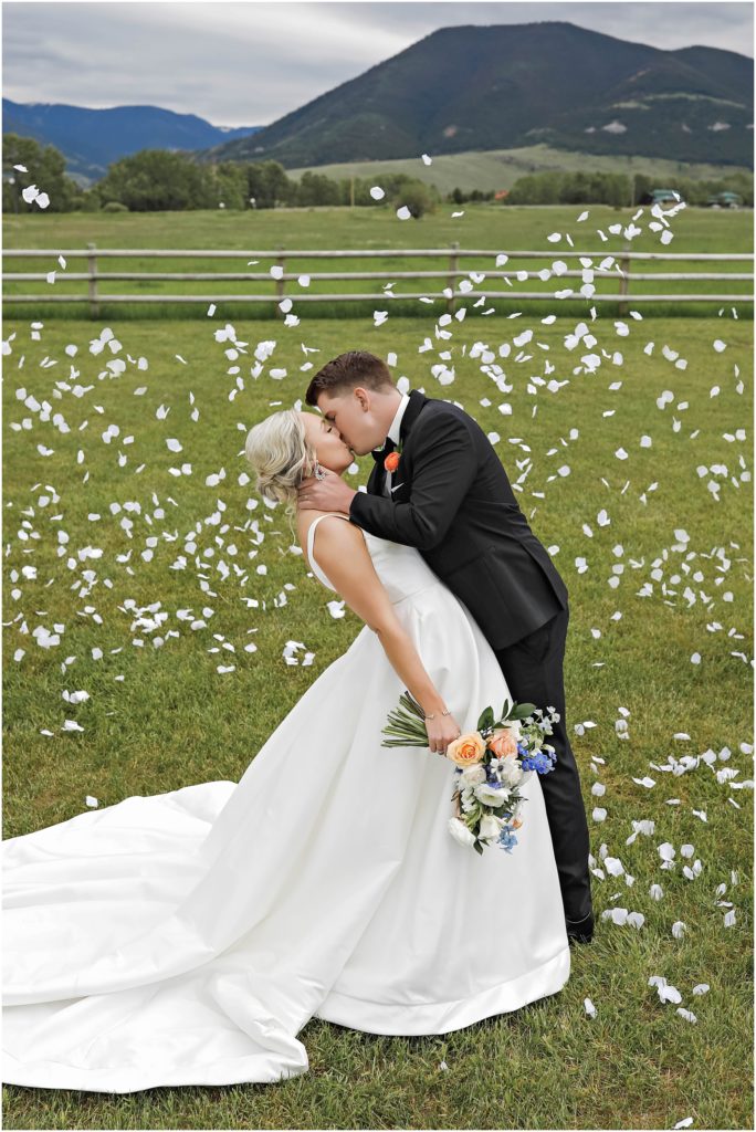 Bride & Groom at Venue 406 Wedding with white flower petals floating