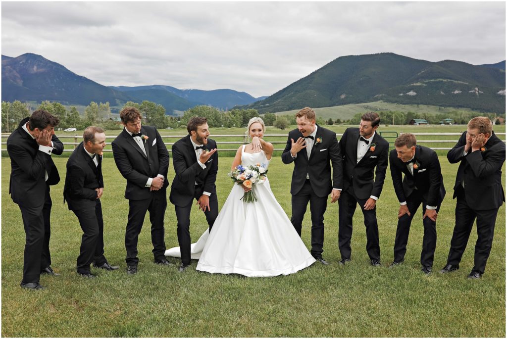 Bride with groomsmen in black tuxes at Venue 406 Wedding