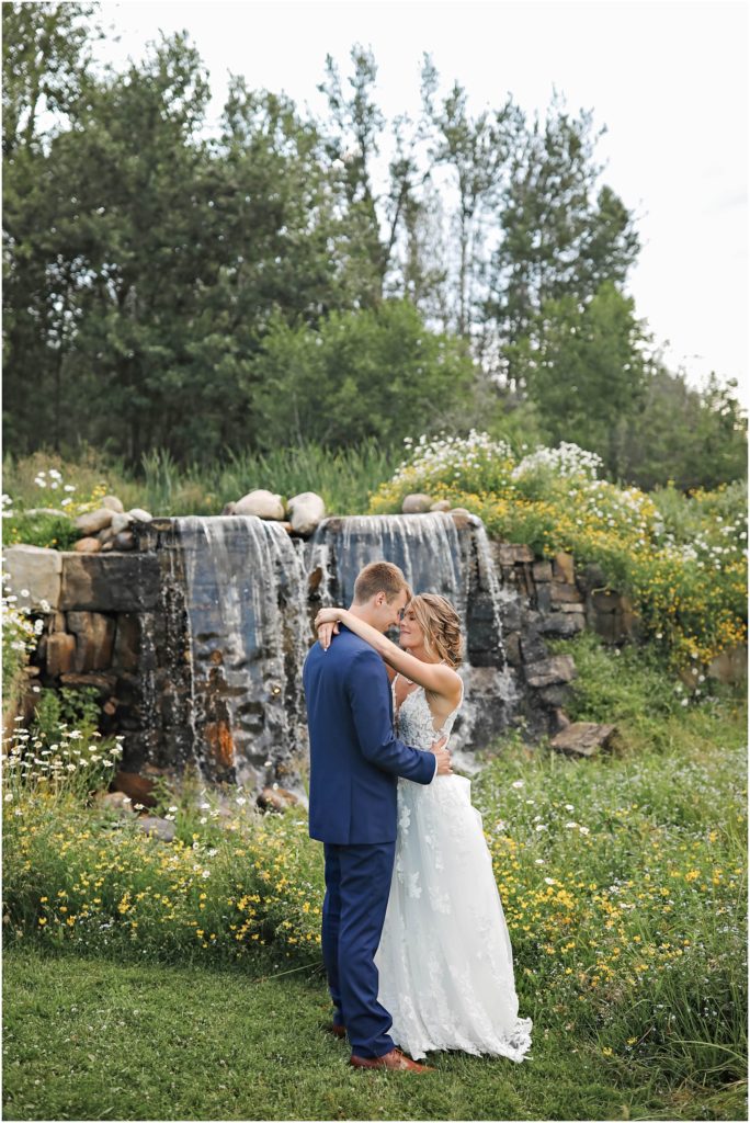 MT Wildflower Wedding Bride and Groom near waterfall