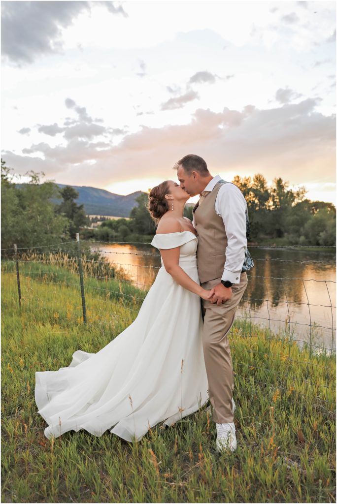 Missoula Wedding Bride and Groom by a river at sunset