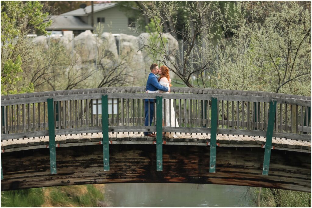 Zoo MT Wedding Bride and Groom on bridge