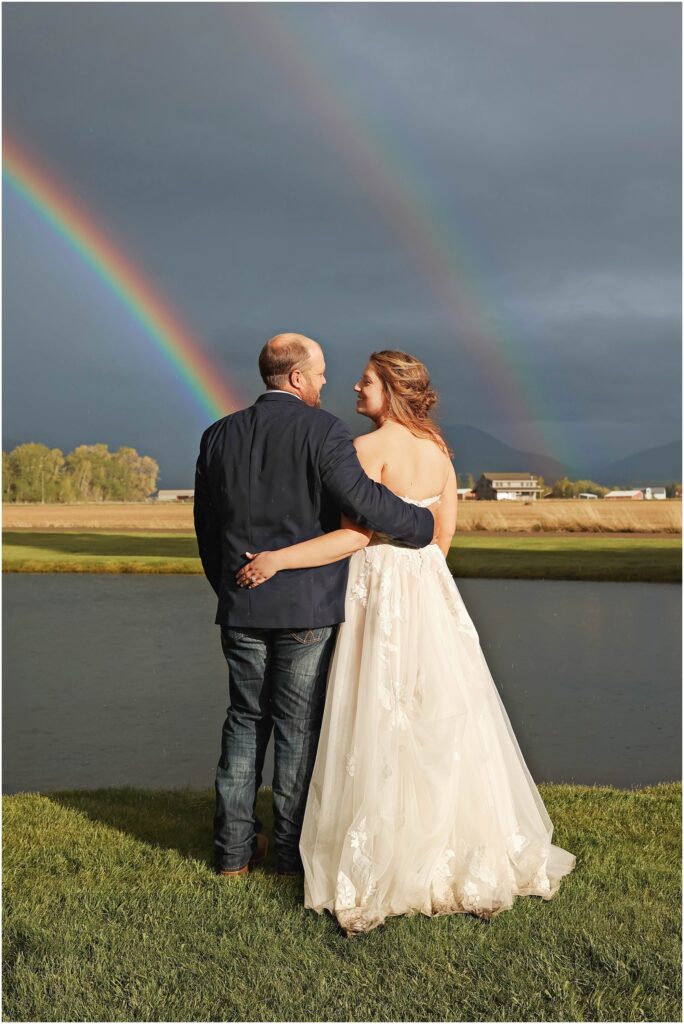 Gallatin Gateway Wedding Bride and Groom standing in front of rainbow