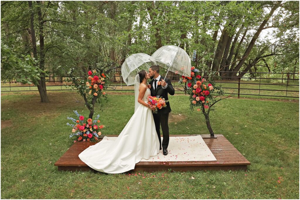 Classy Front Yard Wedding Bride and Groom with Umbrellas