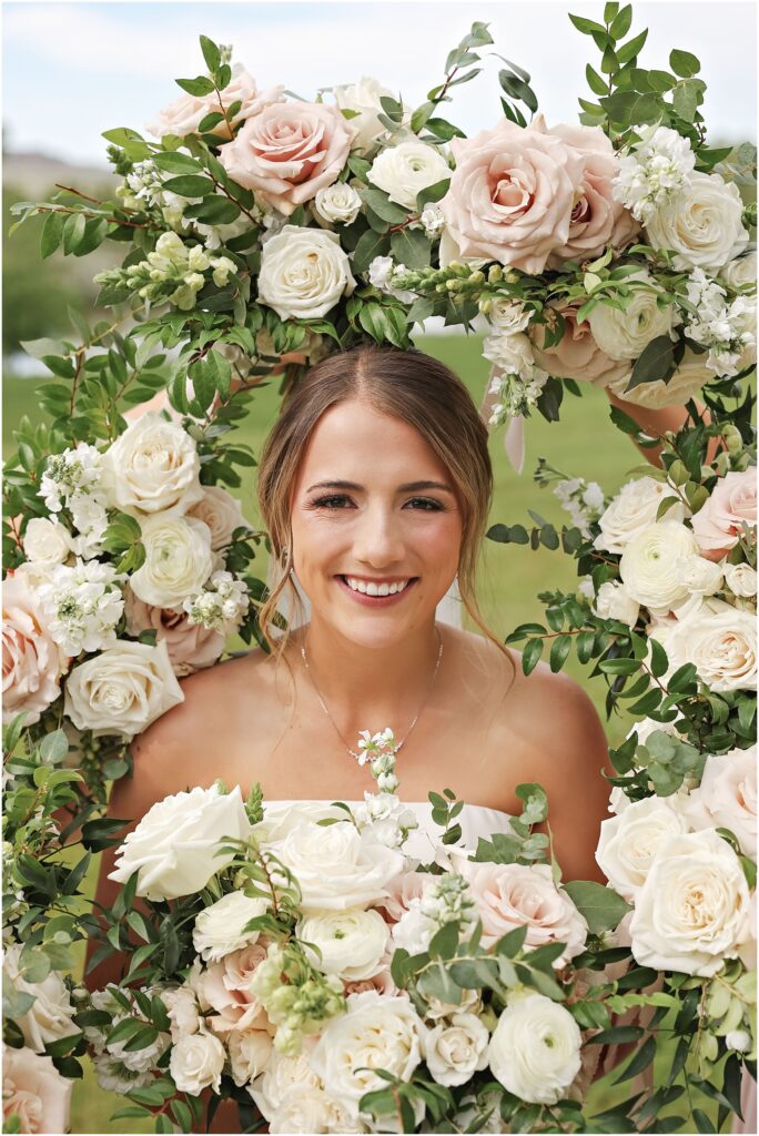 Elegant Montana Wedding at Camelot Ranch Bride surrounded by flowers